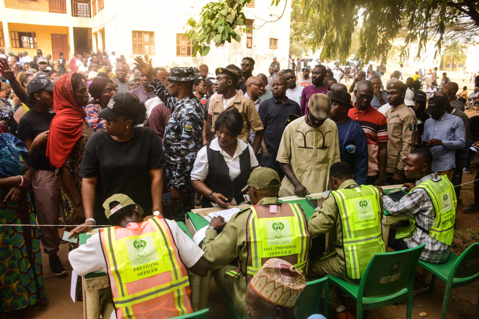 Voters wait on the queue to cast their votes