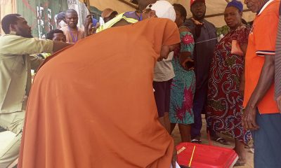 Voter casting ballot