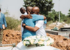 Kenneth being consoled